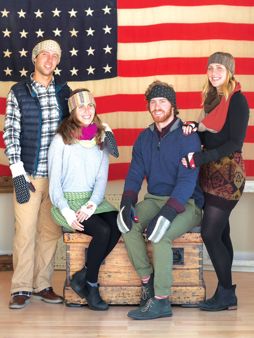two couples posing in front of USA flag wearing Jack & Mary designs