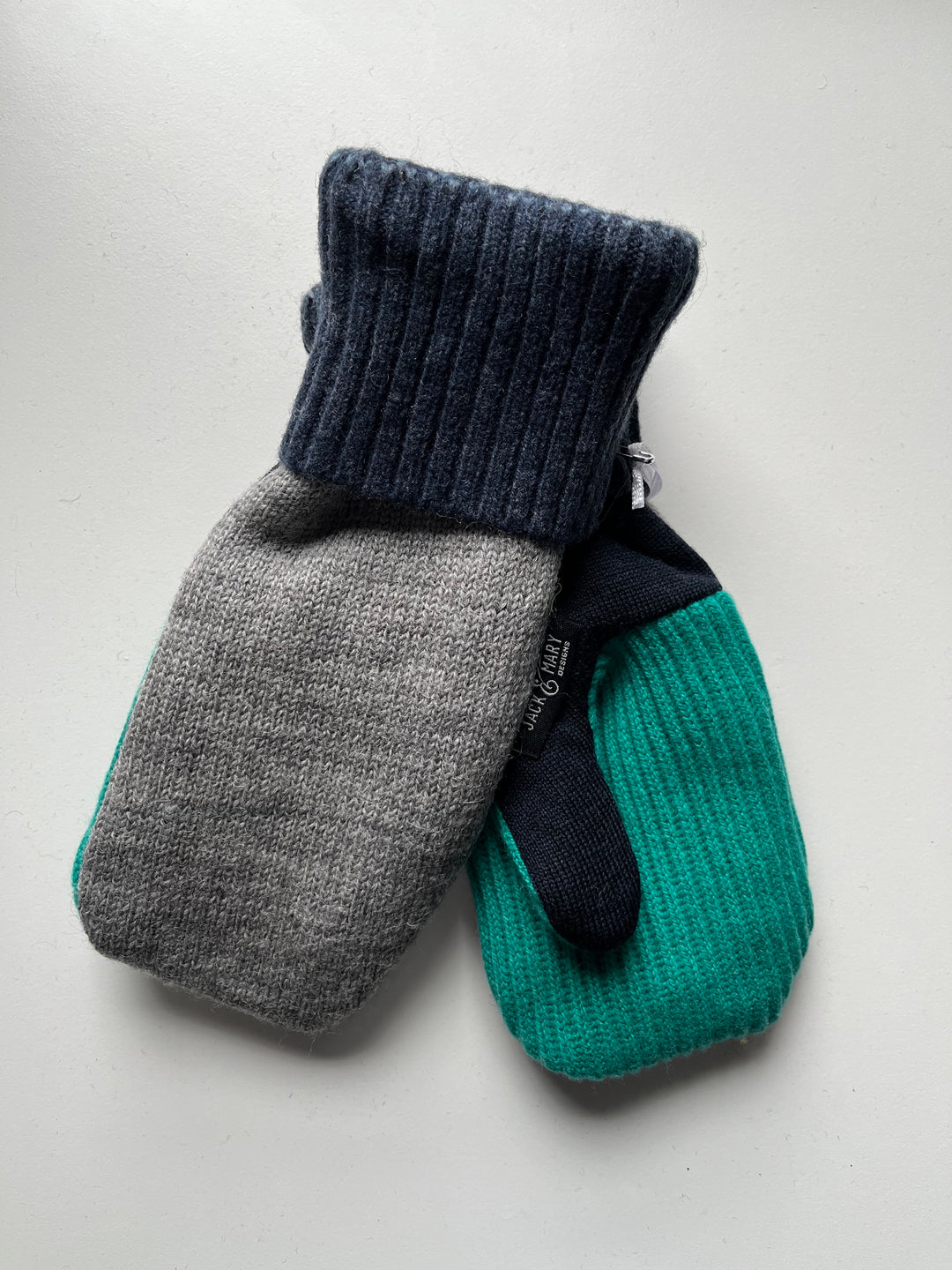Blue, grey, and green mittens