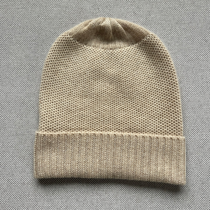 Basket weave slouchy beanie with a ribbed cuff in acorn.